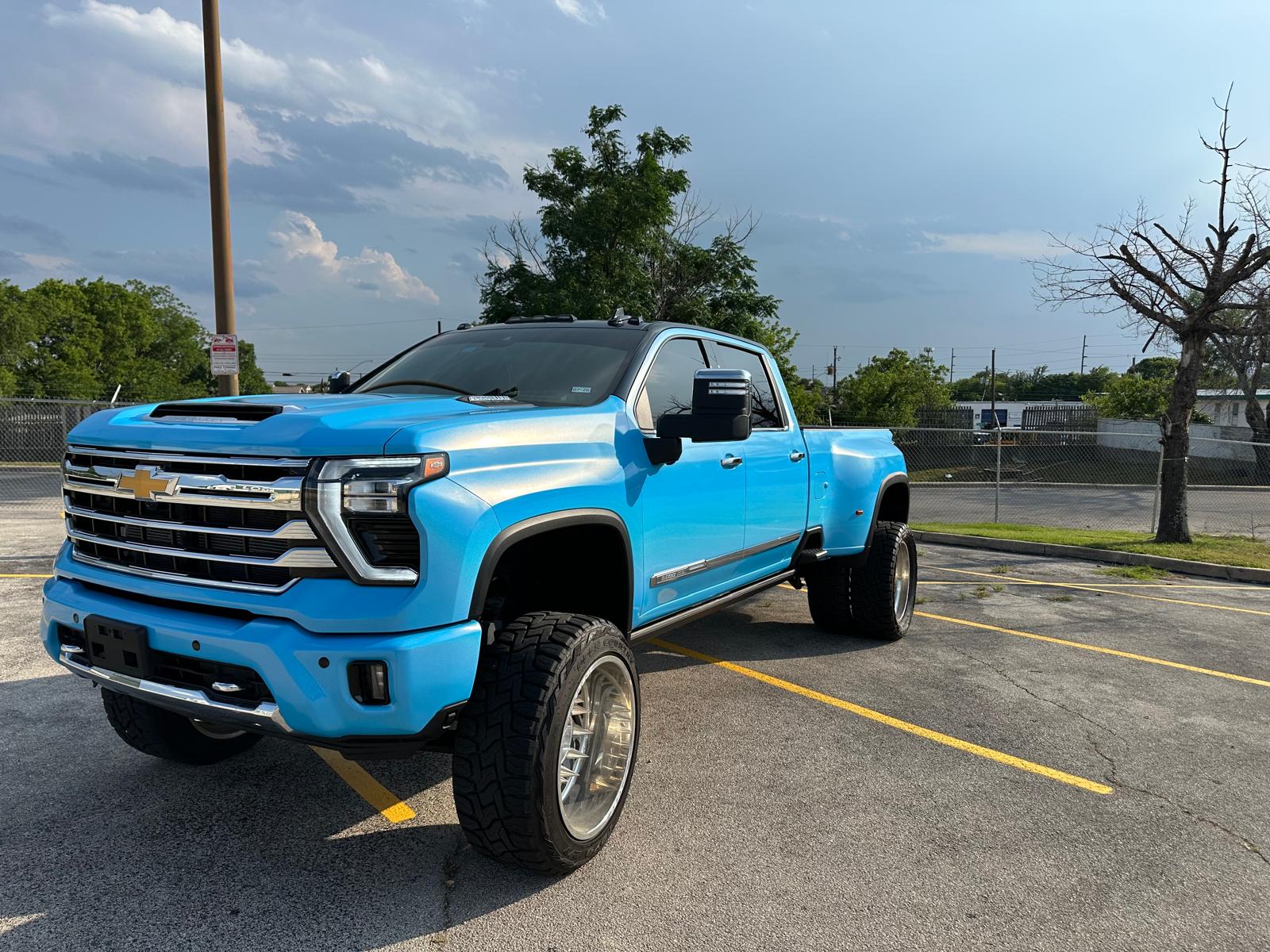 Electric blue lifted truck completed by Phantom Wraps and Coatings in Austin