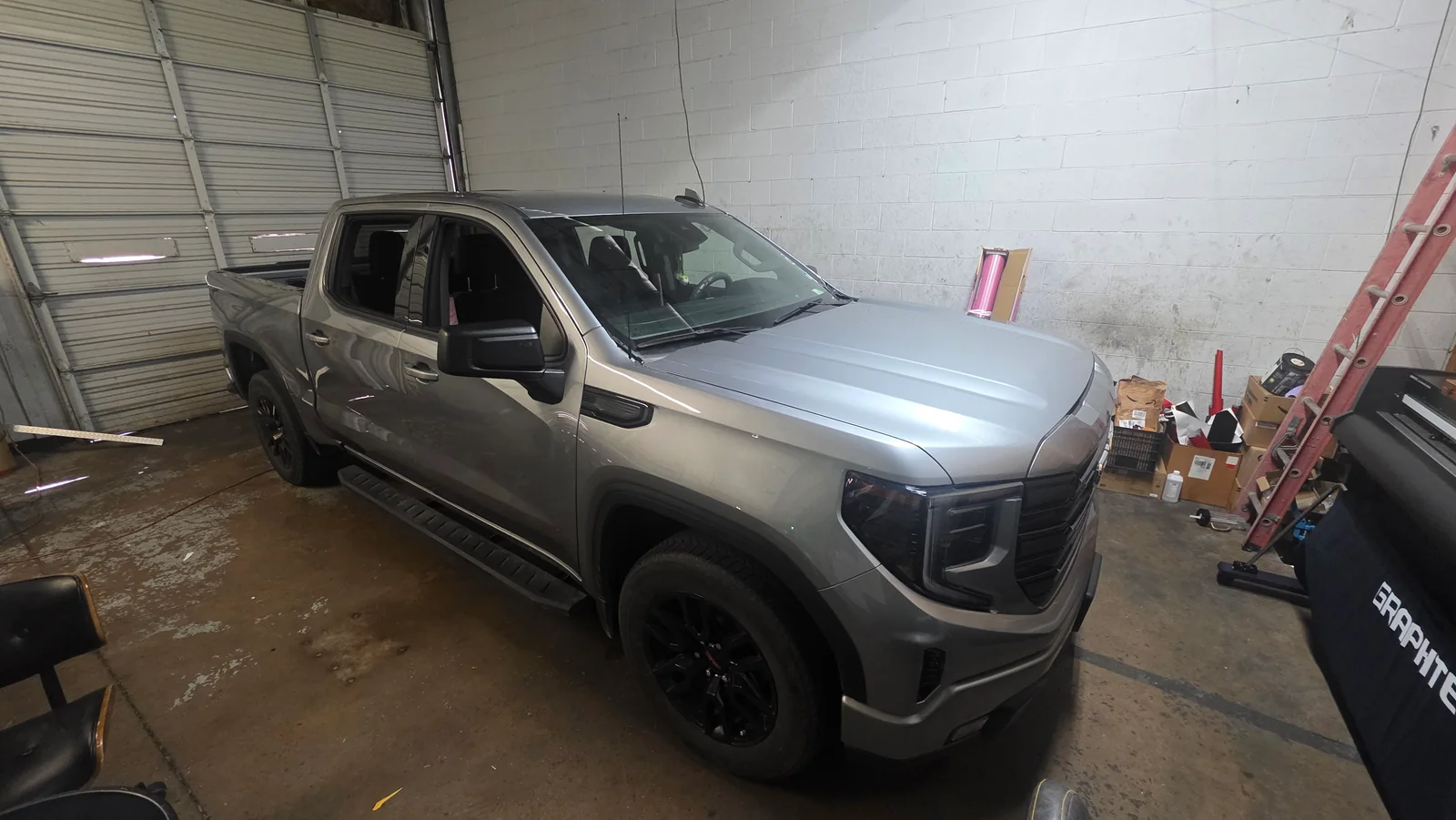 Silver GMC Sierra before its wrap