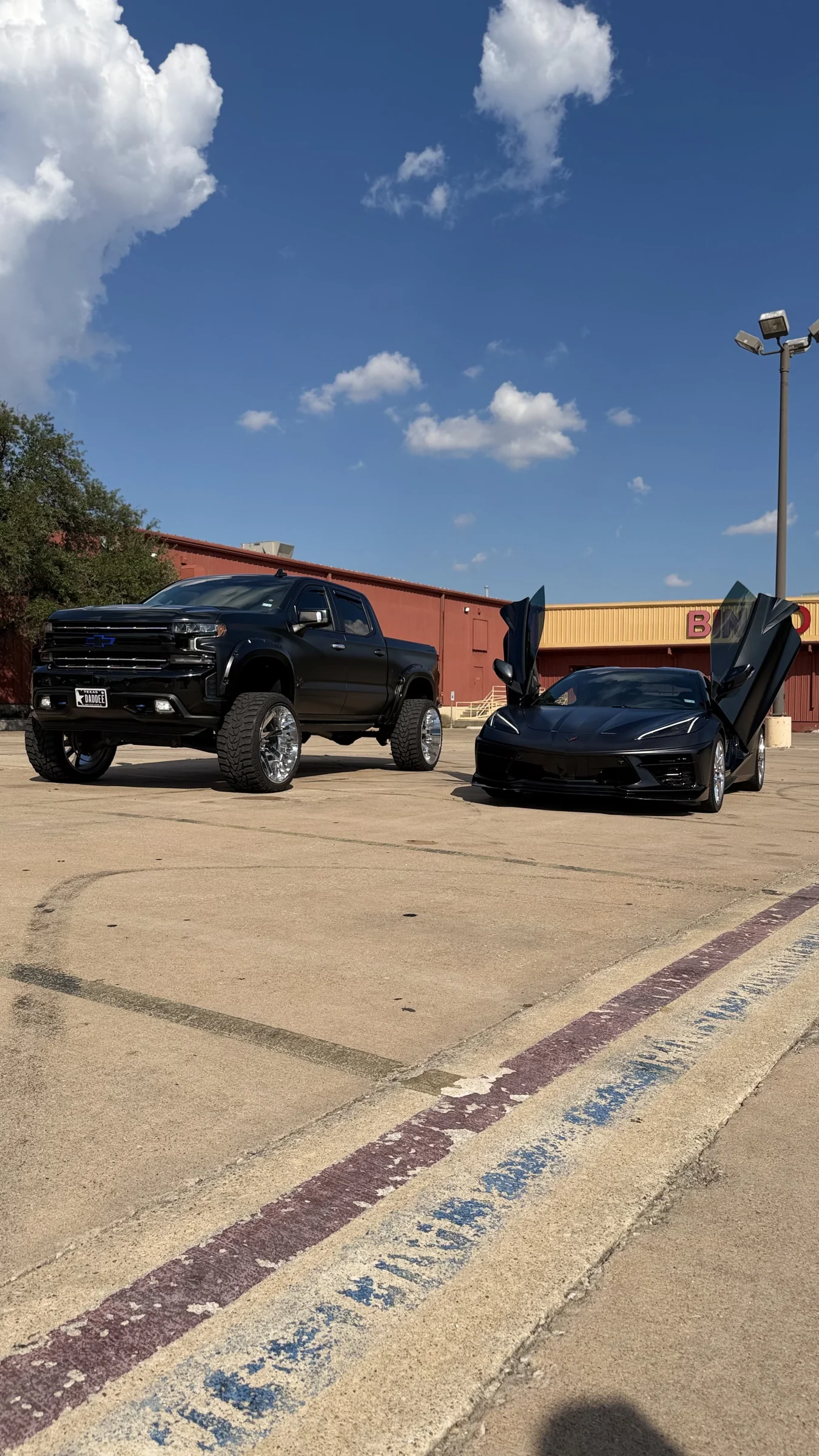 Black Chevrolet truck and Corvette at Phantom Wraps & Coatings