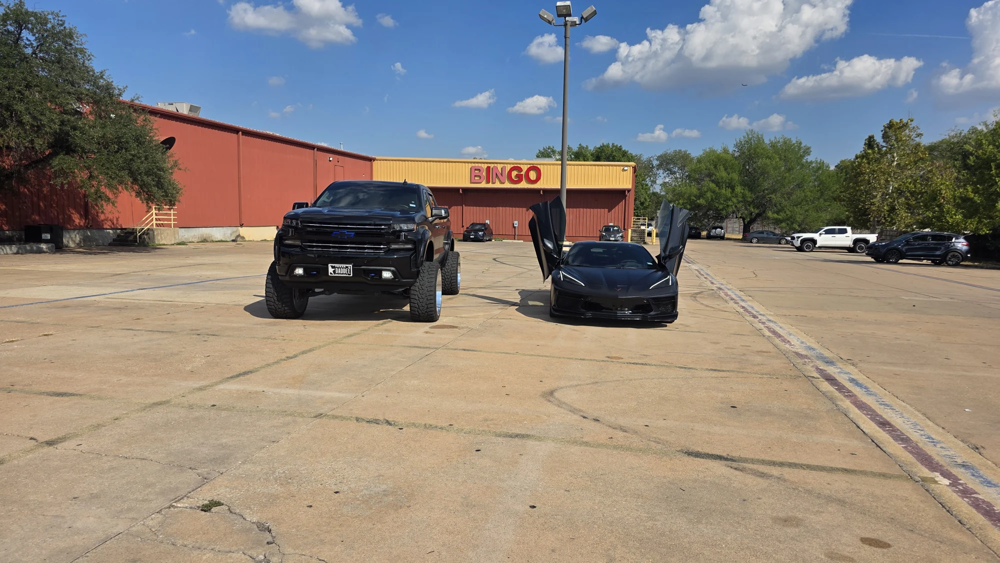 Black Chevrolet truck and Corvette at Phantom Wraps & Coatings